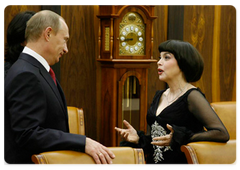 Prime Minister Vladimir Putin and Muammar Gaddafi, the Leader of the Libyan Revolution, presently on a visit in Moscow, attended a concert of French singer Mireille Mathieu at the State Kremlin Palace