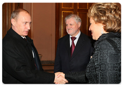 Prime Minister Vladimir Putin and the Chairman of the Council of Federation Sergei Mironov and St.-Petersburg Governor Valentina Matvienko at the International Humanitarian Law Conference