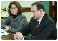 Russian Economic Development Minister Elvira Nabiullina and Norilsk Nickel (GMKN) CEO Vladimir Strzhalkovsky during a meeting with Prime Minister Vladimir Putin