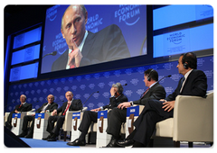 Prime Minister Vladimir Putin answers questions from the audience at the opening plenary meeting of the Davos forum