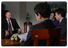 Prime Minister Vladimir Putin giving an interview to the Chinese media