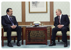 Prime Minister Vladimir Putin during a meeting with Karim Massimov, the Prime Minister of the Republic of Kazakhstan, at the meeting of the Shanghai Cooperation Organisation (SCO) Council of Heads of Government in Beijing