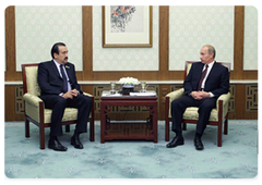 Prime Minister Vladimir Putin during a meeting with Karim Massimov, the Prime Minister of the Republic of Kazakhstan, at the meeting of the Shanghai Cooperation Organisation (SCO) Council of Heads of Government in Beijing