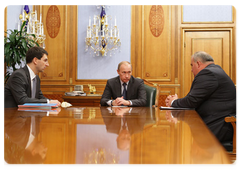 Prime Minister Vladimir Putin during a meeting with Igor Shchyogolev, the Minister of Communications and Mass Media, and Sergei Sitnikov, the Head of the Federal Service for Supervision of Communications, Information Technology and Mass Media