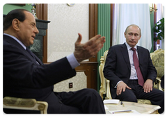 Russian Prime Minister Vladimir Putin and Italian Prime Minister Silvio Berlusconi in a videoconference with their Turkish counterpart Recep Tayyip Erdogan