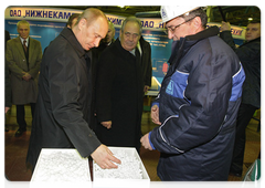 Prime Minister Vladimir Putin visiting an oil refinery and a natural gas processing plant, both of which convert natural resources into products of value, in the city of Nizhnekamsk, Tatarstan