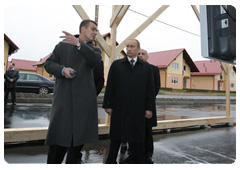 Prime Minister Vladimir Putin visiting low-rise Novaya Izhora development, built for military servicemen