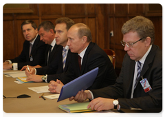 Prime Minister Vladimir Putin meeting with Kyrgyz Prime Minister Daniyar Usenov as part of a conference of the Council of the CIS Heads of Government