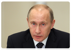 Vladimir Putin chairing an economic meeting