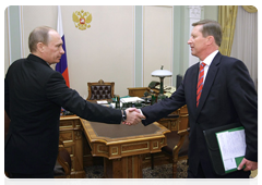 Prime Minister Vladimir Putin during a meeting with Deputy Prime Minister Sergei Ivanov