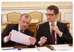Deputy Head of the Government Executive Office Kirill Androsov, right, during a meeting of the Vnesheconombank Supervisory Board
