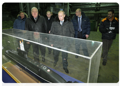 Prime Minister Vladimir Putin inspects diesel electric submarine construction shops at the Admiralty Shipyards in St Petersburg