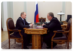 Prime Minister Vladimir Putin during a working meeting with Novgorod Region Governor Sergei Mitin