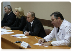 Prime Minister Vladimir Putin visiting the Vishnevsky Research Institute of Surgery, where he held a conference call to deal with the aftermath of a night club fire in Perm