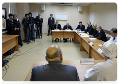 Prime Minister Vladimir Putin visiting the Vishnevsky Research Institute of Surgery, where he held a conference call to deal with the aftermath of a night club fire in Perm