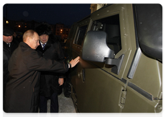 Prime Minister Vladimir Putin and Governor of the Sverdlovsk Region Alexander Misharin inspecting a multipurpose military vehicle Tigr