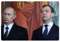 Prime Minister Vladimir Putin and Russian President Dmitry Medvedev at the enthronement of Patriarch Kirill of Moscow and All Russia, the 16th leader of the Russian Orthodox Church