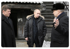 Mr Putin visited a rundown apartment block that was built in the 1940s