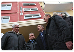 Mr Putin visited new housing complexes being received by Novokuznetsk residents under a programme to resettle tenants of high-risk apartments