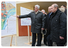 Mr Putin visited new housing complexes being received by Novokuznetsk residents under a programme to resettle tenants of high-risk apartments