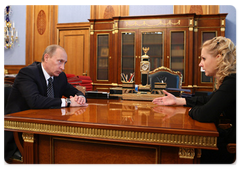 Prime Minister Vladimir Putin holding a working meeting with Minister of Healthcare and Social Development Tatiana Golikova
