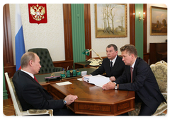 Prime Minister Vladimir Putin during a meeting with Deputy Prime Minister Igor Sechin and Gazprom CEO Alexei Miller