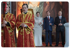 Russian President's spouse Svetlana Medvedeva, Russian President Dmitry Medvedev and Vladimir Putin at an Easter service in Moscow's Christ the Saviour Cathedral