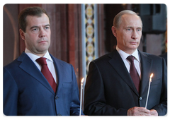 Russian President Dmitry Medvedev and Vladimir Putin at an Easter service in Moscow's Christ the Saviour Cathedral