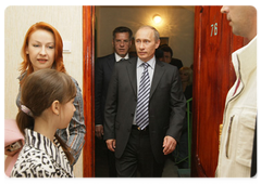 Prime Minister Vladimir Putin visiting the Astrakhan centre to see dilapidated residential houses and old barracks