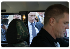Prime Minister Vladimir Putin showing journalists the new Niva car he bought about a month ago