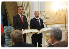 Prime Minister Vladimir Putin and his Norwegian counterpart Jens Stoltenberg conduct a joint news conference following bilateral intergovernmental talks
