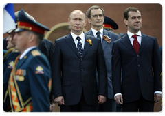 Prime Minister Vladimir Putin, Head of Presidential Executive Office Sergei Naryshkin and President Dmitry Medvedev during the ceremony of laying a wreath at the Tomb of the Unknown Soldier