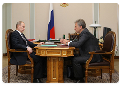 Prime Minister Vladimir Putin during a working meeting with Minister of Industry and Trade Viktor Khristenko
