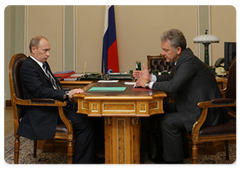 Prime Minister Vladimir Putin during a working meeting with Minister of Industry and Trade Viktor Khristenko