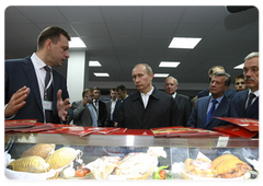 Prime Minister Vladimir Putin touring the Korocha meat processing plant