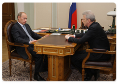 Prime Minister Vladimir Putin during a meeting with Education and Science Minister Andrei Fursenko