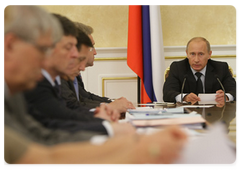 Prime Minister Vladimir Putin chairing a meeting on economic problems