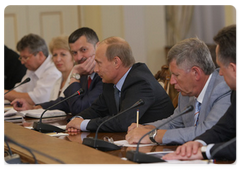 Prime Minister Vladimir Putin with members of the editorial board of Soviet Sport newspaper on its 85th anniversary