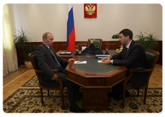 Prime Minister Vladimir Putin holding a working meeting with the Minister of Telecommunications and Mass Media, Igor Shchyogolev