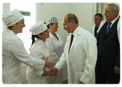 Prime Minister Vladimir Putin visiting a new Sukhumi maternity hospital, which was renovated with Russian assistance