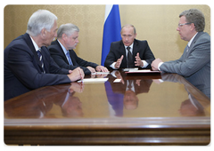 Prime Minister Vladimir Putin during a meeting in Sochi with State Duma Speaker Boris Gryzlov, Federation Council Speaker Sergei Mironov, and Deputy Prime Minister and Finance Minister Alexei Kudrin