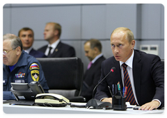 Prime Minister Vladimir Putin chairing a telephone conference on the Sayano-Shushenskaya Hydropower Plant disaster at the National Emergency Management Centre of the Ministry of Civil Defence, Emergencies and Disaster Relief