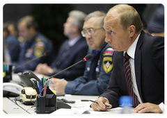 Prime Minister Vladimir Putin chairing a telephone conference on the Sayano-Shushenskaya Hydropower Plant disaster at the National Emergency Management Centre of the Ministry of Civil Defence, Emergencies and Disaster Relief