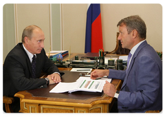 Prime Minister Vladimir Putin during a working meeting with Sberbank CEO German Gref