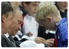 Prime Minister Vladimir Putin at a national hockey team training session in the Ice Palace at Khodynskoye Pole
