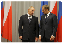 Russian Prime Minister Vladimir Putin and Polish Prime Minister Donald Tusk attending the ceremony of signing three documents