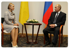 Prime Minister Vladimir Putin with Ukrainian Prime Minister Yulia Tymoshenko during his visit to Poland