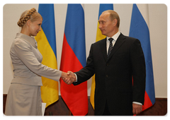Prime Minister Vladimir Putin with Ukrainian Prime Minister Yulia Tymoshenko during his visit to Poland