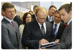 Russian Prime Minister Vladimir Putin visiting an exhibition of development plans for the constituent entities of the Russian Federation as part of his participation in the Sochi International Investment Forum