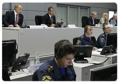 Prime Minister Vladimir Putin during a meeting at the National Crisis Management Centre of the Ministry for Emergencies held to discuss the relief efforts at the Sayano-Shushenskaya power plant